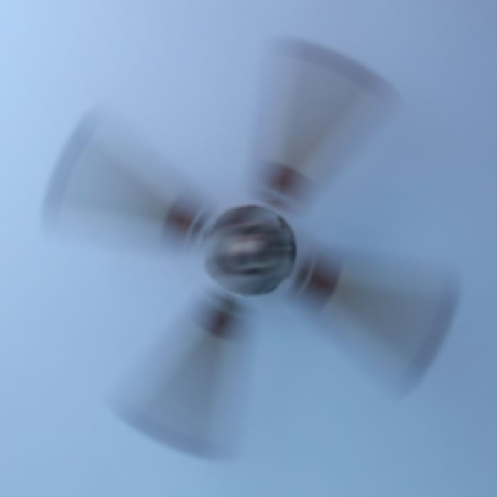 I barely opened my eyes to peer at the ceiling fan spinning above me. Instead of seeing the copper-colored medallion anchoring the faux-wooden blades, I noticed a furry bearded head with two horns staring at me.