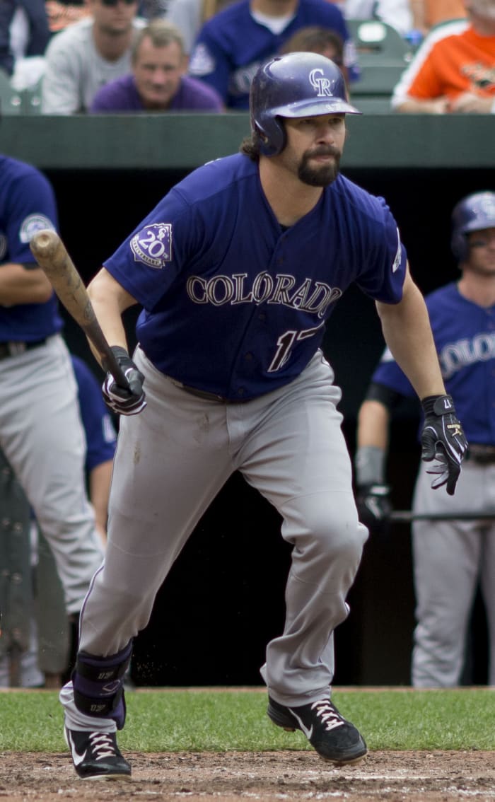 Former Colorado Rockies first baseman Todd Helton runs to first base during a game in 2013. Helton holds a handful of franchise records after he spent all 17 years of his career with the Rockies.