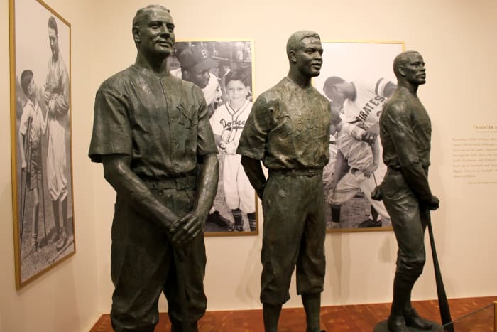 A display depicting statues of Lou Gehrig (left), Jackie Robinson (center) and Roberto Clemente (right) was on display at the Baseball Hall of Fame in Cooperstown, New York, in 2014.
