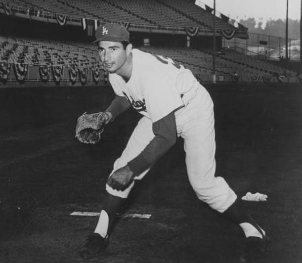 A young Sandy Koufax poses for a photo early in his career with the Los Angeles Dodgers. Despite an early retirement that left him with only a 12-year career, Koufax is regarded as one of the greatest left-handed pitchers in baseball history.