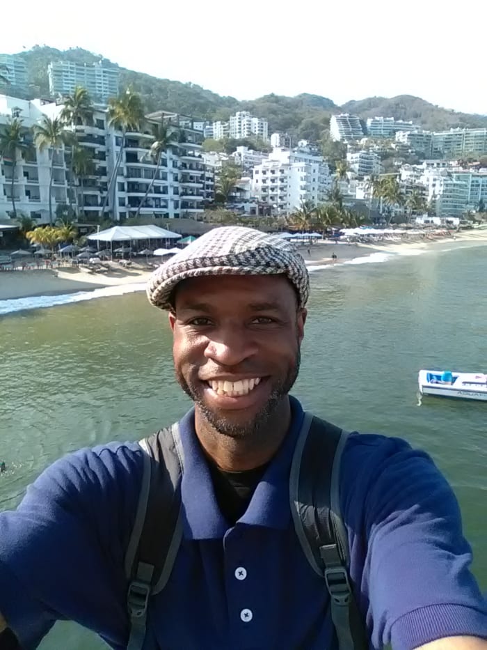 My online revenue streams allow me to be able to travel the world. Here I'm enjoying the sun and sand in Puerto Vallarta, Mexico