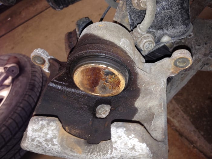 This brake caliper is leaking past the piston o-ring and is causing a soft brake pedal.
