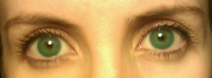 Because my true eye color shows through the translucent color, between the lines of the opaque pattern, the contacts make my eyes look more aqua-green than blue.