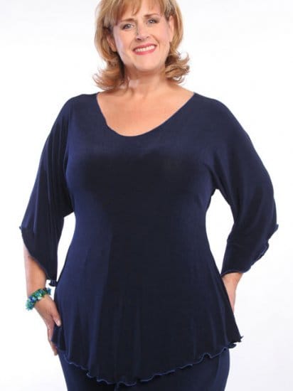 This tunic, with its deep neck and crease proof fabric, is ideal for a travel wardrobe. The shaped hemline makes it ideal for the plus size figure and helps to make legs look longer.