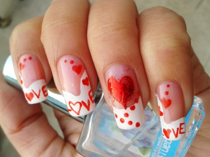 I used transfer foil for the heart on the ring fingernail. It gives a metallic finish. Anyhow, it is a little messy on my nails. I was in a hurry while doing it, and my base nail polish was not completely dry.
