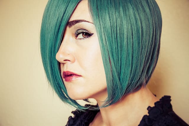 Turquoise green hair. A little green color added keeps the color blue but completely transforms the shade.