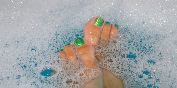 Before beginning a pedicure, allow nails, cuticles, and calluses to soften in either the tub, the shower, or a foot bath.