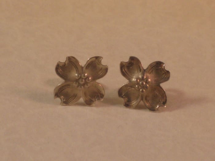 Boiling Water versus Warm Tap Water: After: The earring placed in boiling water is on the left. The earring placed in warm tap water is on the right. Notice the right earring is still much less tarnished than it was prior to the bath!