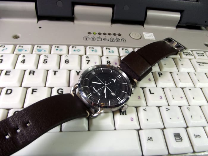 One Eleven CMP0002 solar powered quartz watch with leather strap. This timepiece is perched upon my much loved Itronix GoBook 3 laptop
