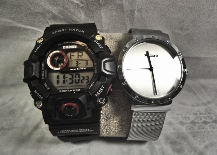 Paidu 58919 Analog Watch alongside a similarly priced Skmei product. This demonstrates the contrast between a simple and a complicated design.