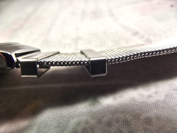Paidu 58919 Analog Watch. Because of their rigidity, it can sometime be difficult to tuck the belt end beneath the free loops.