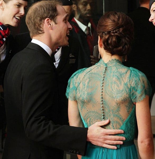 Kate Middleton's dress' intricate lace fabric is highlighted and held together by a line of tiny buttons that run down the spine.