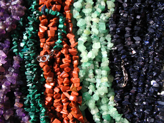 Jewelry makes a statement. Try to get necklaces that have texture and make sure the length is right for you.