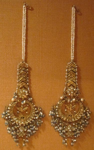 Mughal gold earrings strewn with gemstones, premium beads, and long strings of tiny pearls
