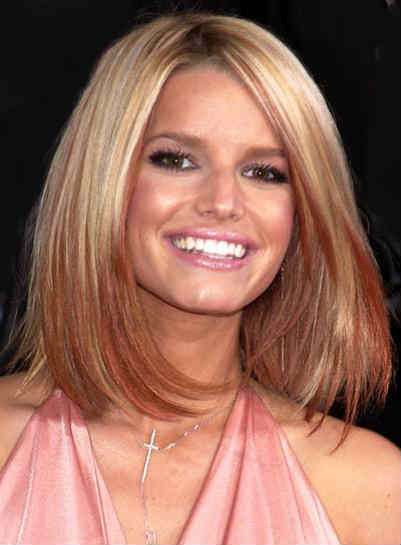 This is a great length for a rectangular face with just a few long layers in it. It really compliments her overall look.