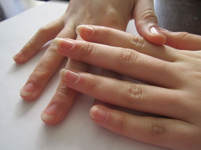 My sister agreed to be my model for this hub. Her fingers are so long and dainty! She wanted to file her own nails though, I probably would have rounded them more, but she likes them this way.
