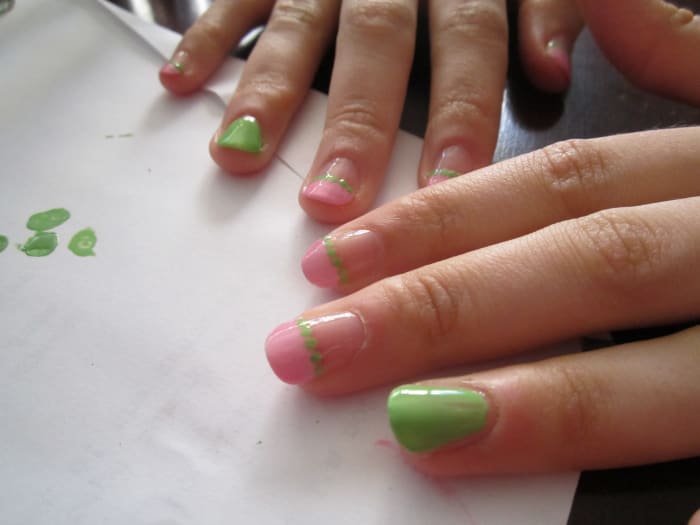 We were impatient and didn't wait for the pink polish on her ring finger to dry so we had to change our design. But here's her manicure with the dots applied.