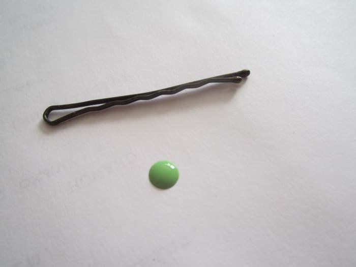 To make the dots on her manicure I dabbed some green polish on paper and used a bobby pin as a dotting tool.
