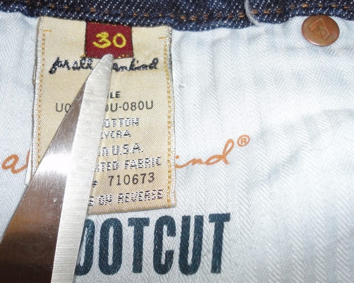 Inside tag shows clearly the screen printed style code & cut #. Also note the stamped emblem rivet
