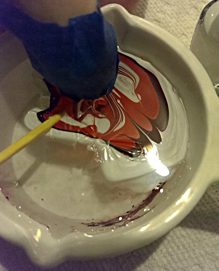 Make sure all of the excess nail polish is taken up from the water before pulling your nail out!