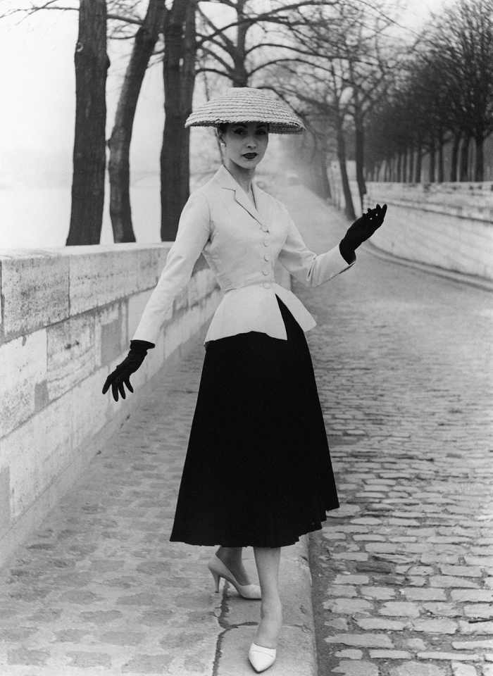 Photograph of 'New Look' suit designed by Christian Dior. Photographed by John French. London, England. 1947.