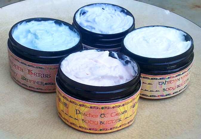 These are my finished body butters, packaged and labeled. The scents are Tahitian Vanilla (white), Peaches & Cream (pink), Tuscan Herbs (green), and Lavender (lavender). Mica colors were added to tint these.