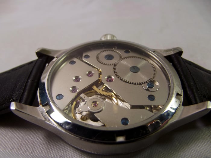 Corgeut 1527 mechanical watch with Asian 6498 movement. Unlike most movements of this type, there is no adjustment lever attached to the balance wheel.