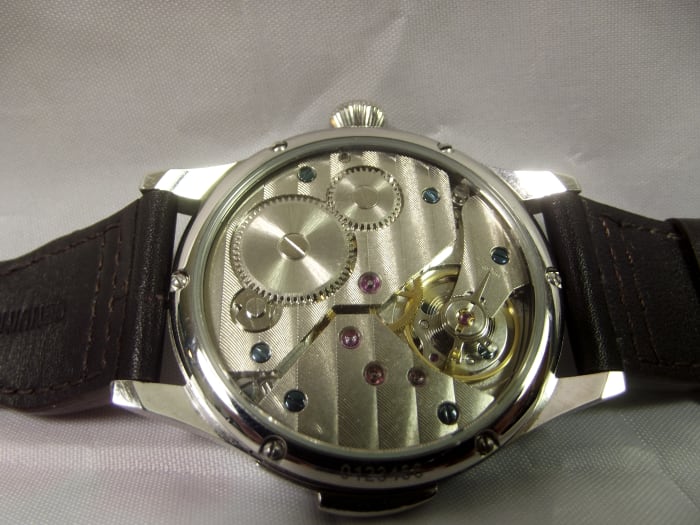 Unbranded Parnis Mechanical Watch with Seagull 6497 Movement. Note the lever (for adjusting accuracy) above the watch's balance wheel.