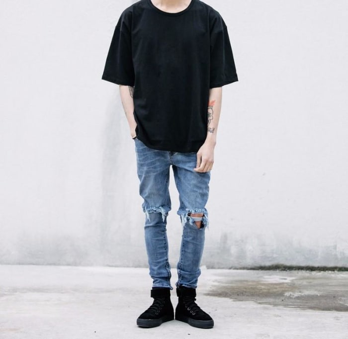 The distressed jeans and oversized shirts (like those released by Fear Of God and Yeezy) take a lot of inspiration from the skater and grunge cliques in the 90s. And the oversized aesthetic can even be traced back to hip hop culture in the 90s.