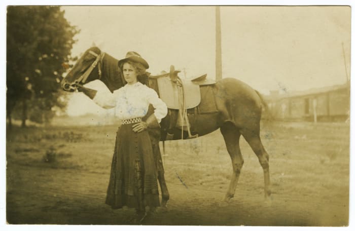 If you look closely you'll see that the horse is wearing a sidesaddle.
