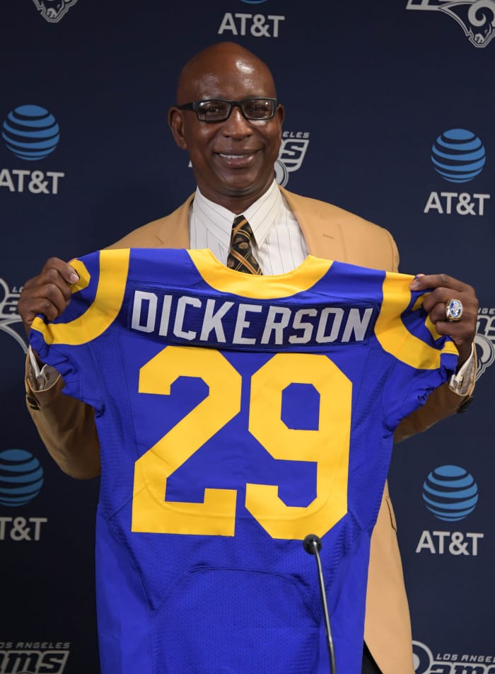 Former Los Angeles Rams running back, Eric Dickerson, poses with No. 29 jersey during a press conference after signing a one-day contract to retire as a member of the Rams at Cal Lutheran University on August 29, 2017.