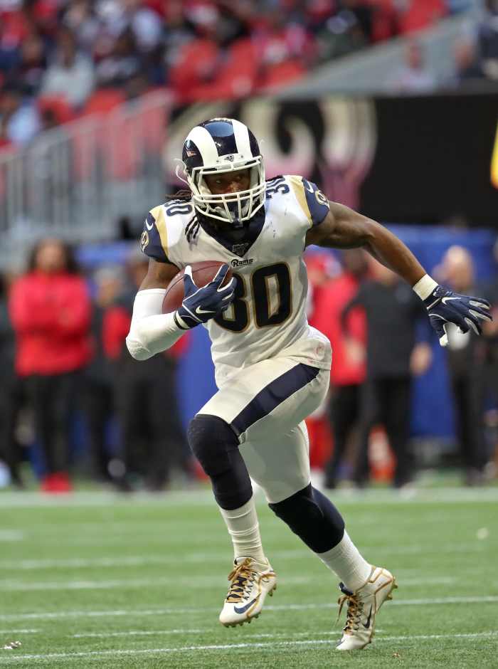 Los Angeles Rams running back, Todd Gurley, runs the ball in the fourth quarter against the Atlanta Falcons at Mercedes-Benz Stadium in 2019.