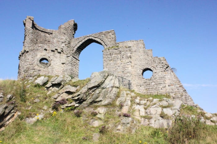 Mow Cop Castle in Cheshire, England is a folly that was built in 1754 to resemble a ruined medieval fort.