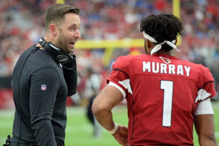 Arizona Cardinals head coach, Kliff Kingsbury, gives directions to rookie quarterback, Kyler Murray (1), in a 2019 game against the Detroit Lions at State Farm Stadium. A former quarterback, Kingsbury has been entrusted to develop Murray into a star,