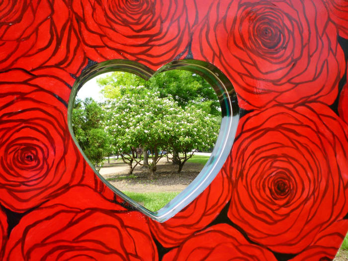 Looking through “Heart of the Heights” sculpture by Eisenhut/Ramos in True South sculpture exhibit in Houston