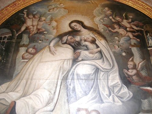 Mary nursing the baby Jesus...and a saint. Photo Credit http://www.flickr.com/photos/quinet/99603058/ under Creative Commons Attribution License