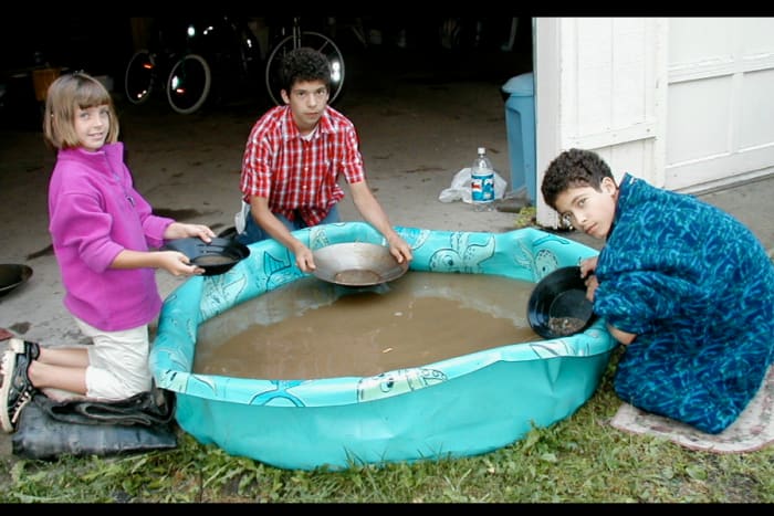 A bucket of gravel and sand from an old gold mining area was dumped into the kiddie pool. The grandchildren (ages 6-12) loved gold panning! Yeah, water and dirt!