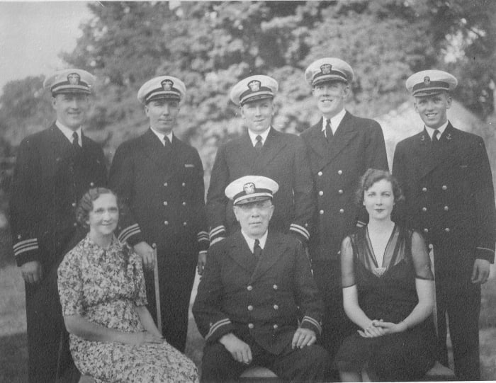 The five Olsen brothers in 1938 ( standing) with their parents and sister( seated)