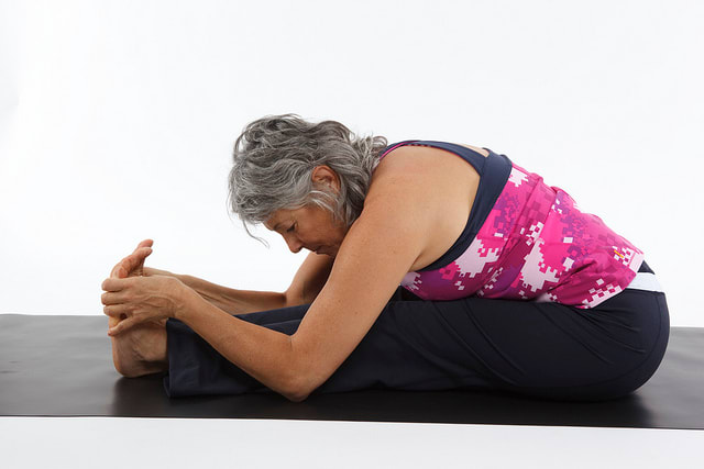 Only stretch as far forward as is comfortable for you. Everyone's flexibility is different.