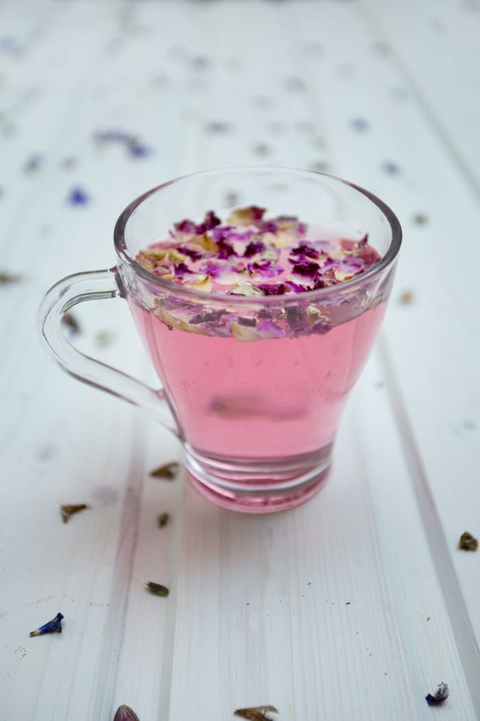 This glass of beverage is the same color as my favorite Pedialyte flavor but with some flowery stuff thrown on top.