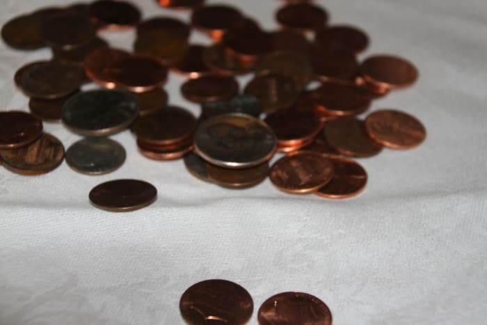 Students with visual impairments use diameter, thickness, and edge texture to identify coins.