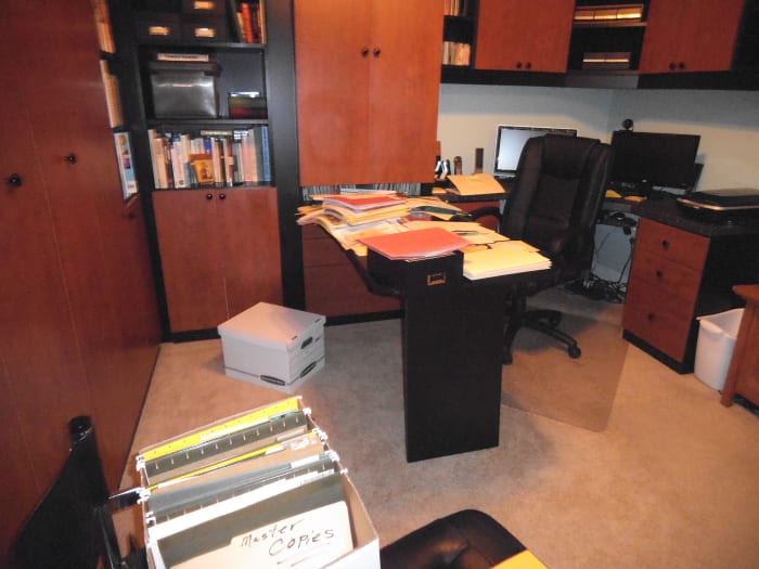 The cabinets hide the amount of family history stored in this room It needs to be thinned down to a more compact amount.