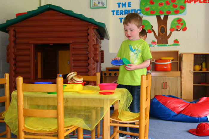 Pretending to cook and serve food with a play kitchen will increase a child's language skills.