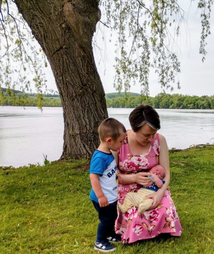 Big brother "helping" me when baby brother started crying. I have taught him to say "No more tears, don't cry" when baby brother starts crying, rather than touching or imitating him.