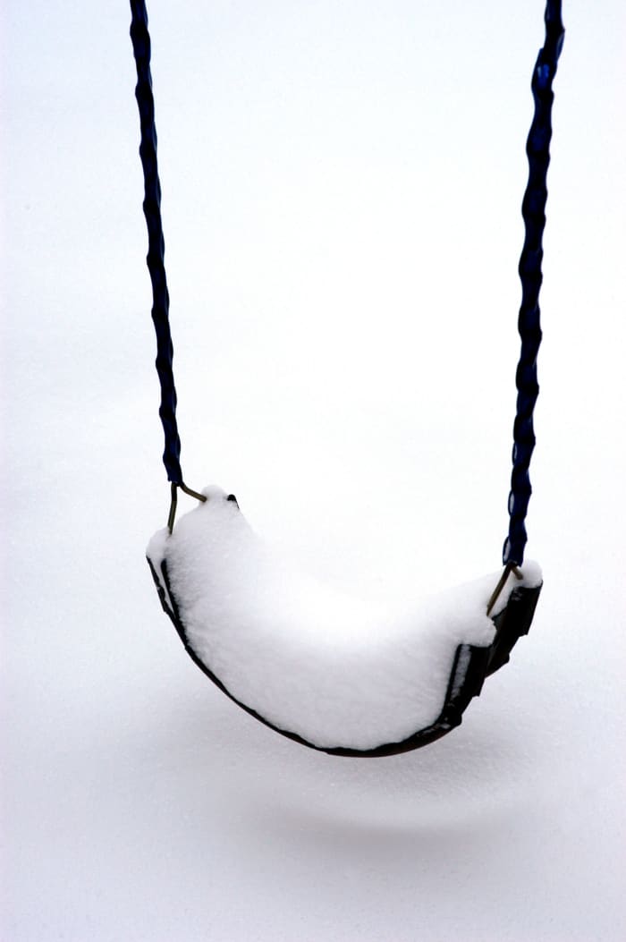 photo credit Glenn Mcgloughlin Don't brush the snow off yet, swinging on a swing is not a good idea.