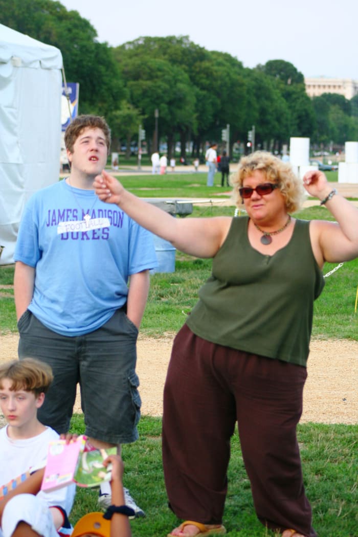 This fine mother is a freaking professional. Notice how her kids try their best to ignore her. But mama's got the moves, the look, and her attitude says "look at ME!"