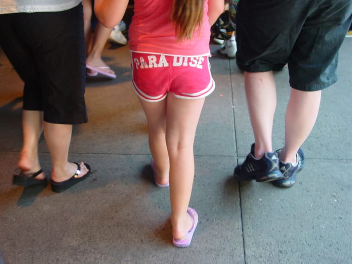 This little girl's rear reads "PARADISE." Not the best fashion choice. Should she even own this item of clothing?