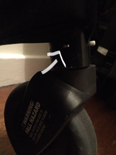 All four wheels can be taken off by pushing a button. Just look for the small silver button on every wheel.