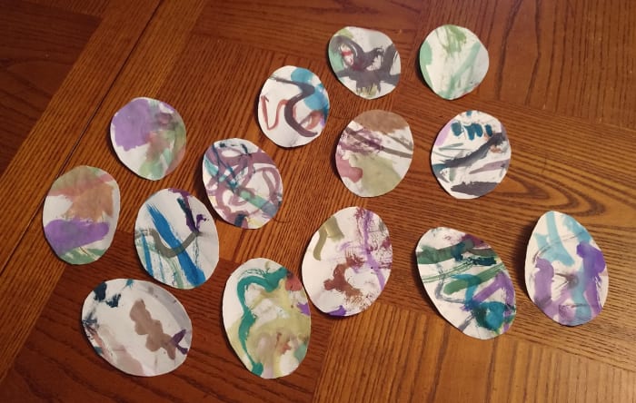 Rather than being saved in a pile or folder somewhere never to see the light of day, my two year old's water color painting, was cut into Easter eggs, and sent in Easter cards to the grandparents and great grandparents.