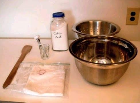 The rennet is missing from this picture. The citric acid is the white powder in the jar. I keep special towels for cheese making, and mark them with an embroidered "C". You won't want to use the same towels for cheese and kitchen chores.